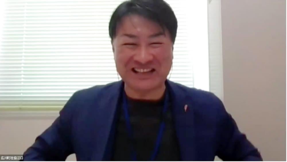 A video still of Shinya Eguchi taking part remotely.