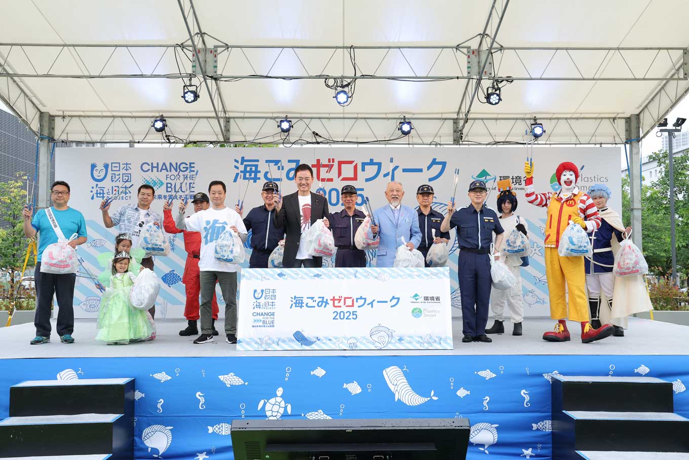 Group photo of representatives of participating organizations on stage
