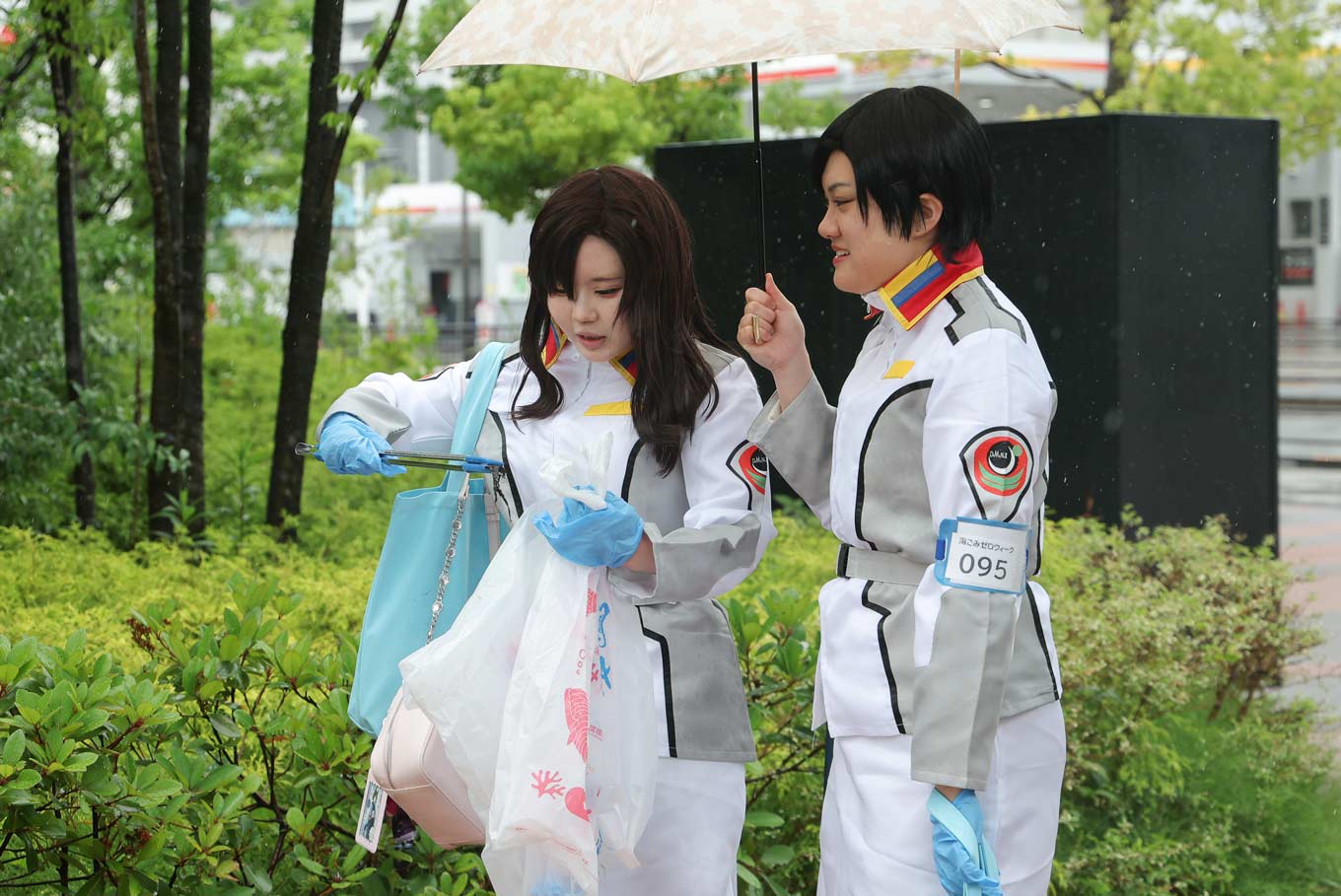Photo of cosplayers picking up trash