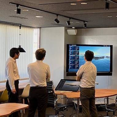 Photo of staff reviewing the engine plant monitoring system