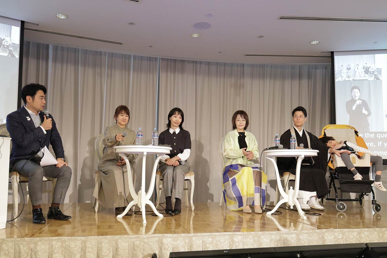 Photo of Takahiro Takano and the panelists