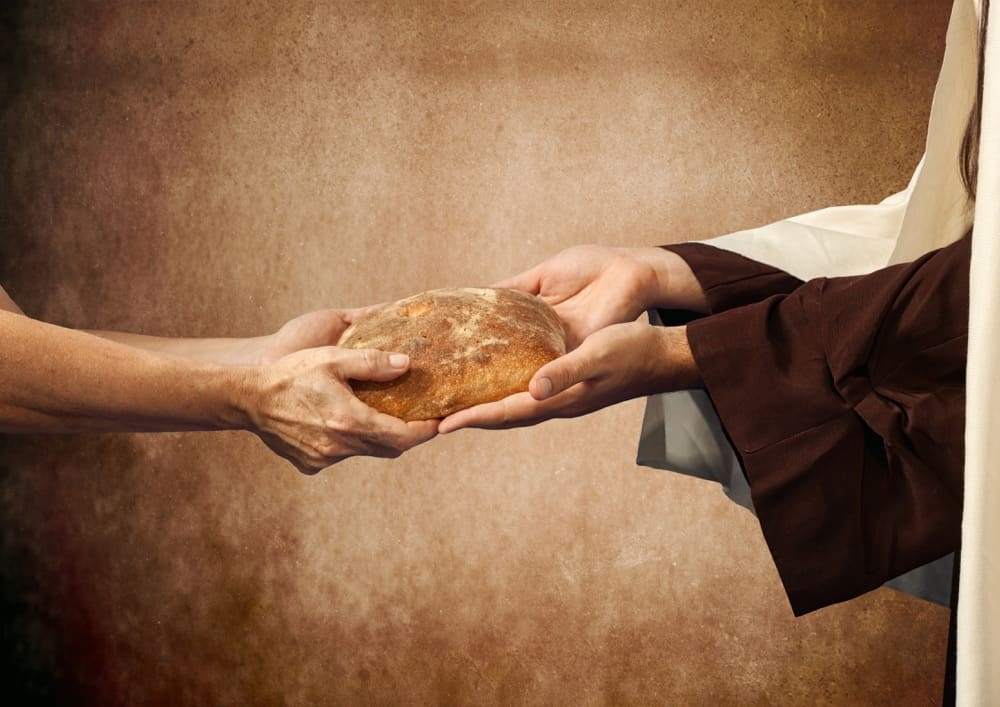 Image: Pastor sharing bread
