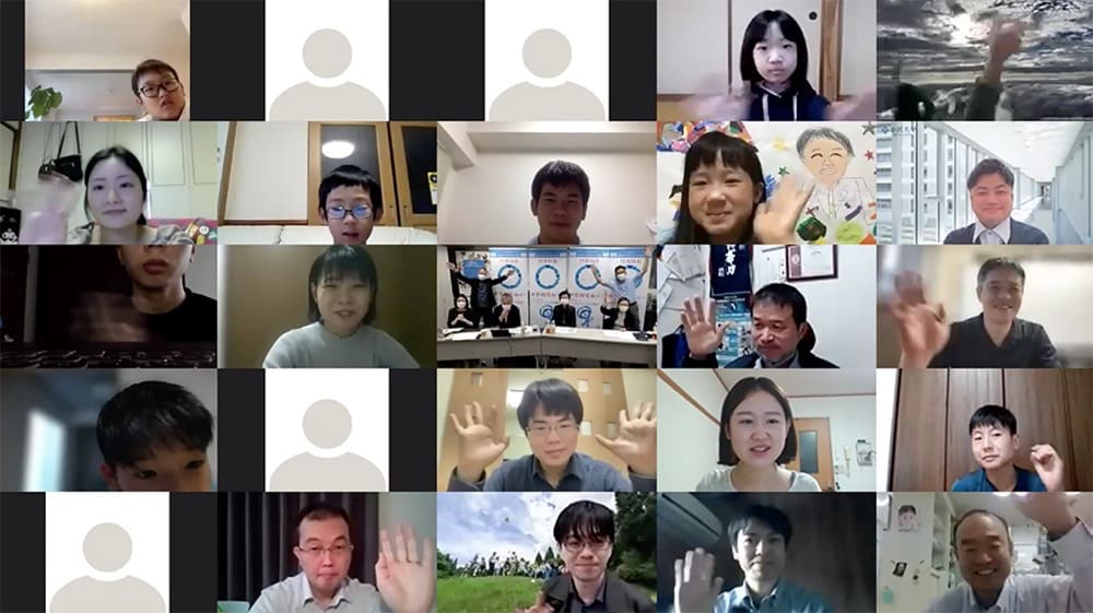 The participants, from young to old, greet each other from their computer screens.