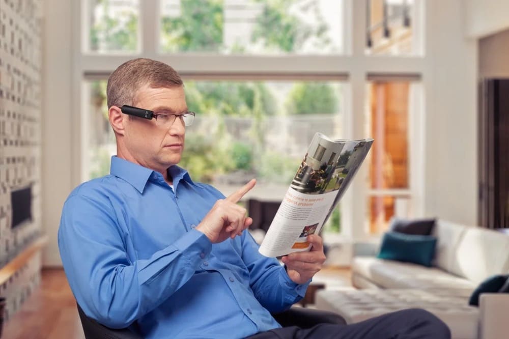 A person using OrCam MyEye