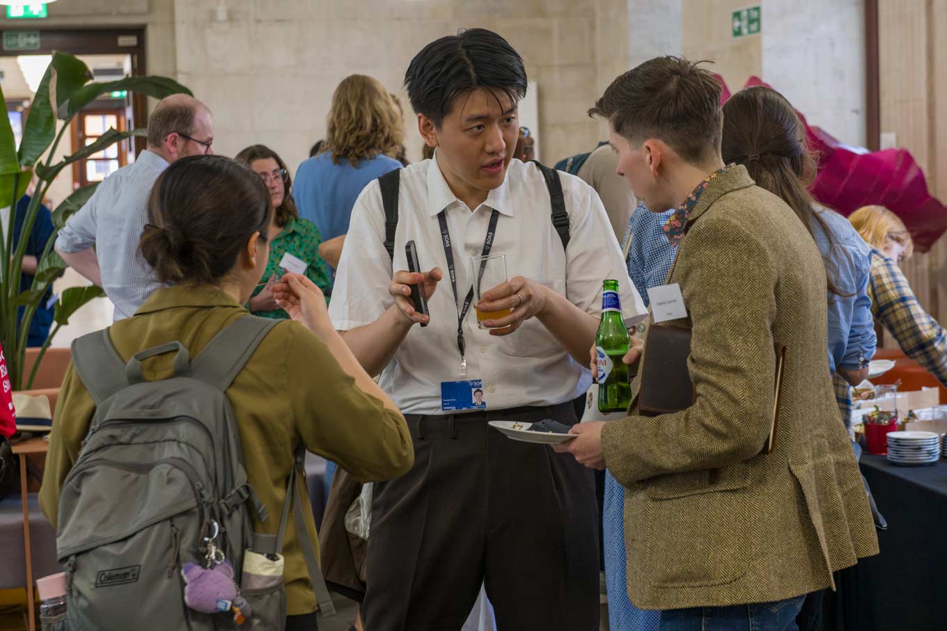 Photo of students having a discussion during the reception