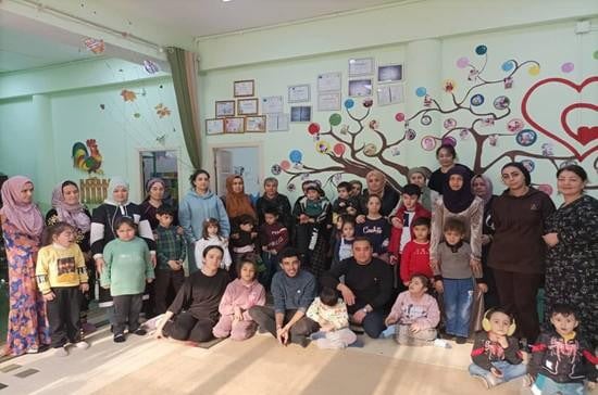 Group photo of parents, teachers, and children