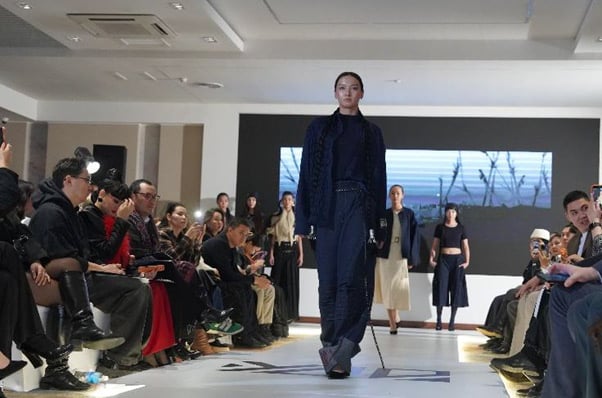 Photo of a model walking on a runway