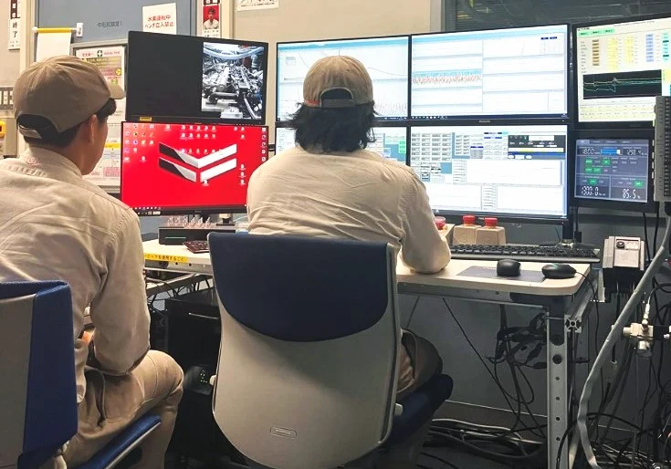 Photo of staff monitoring computer screens