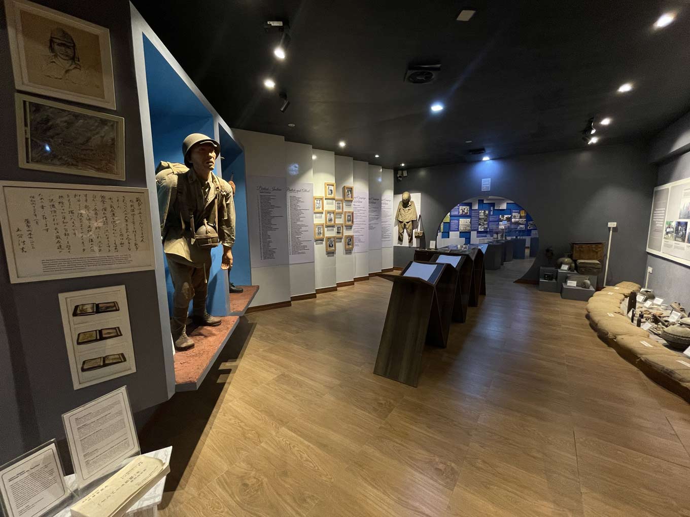 Photo of the museum’s war section, with a soldier mannequin, display panels, and wartime artifacts