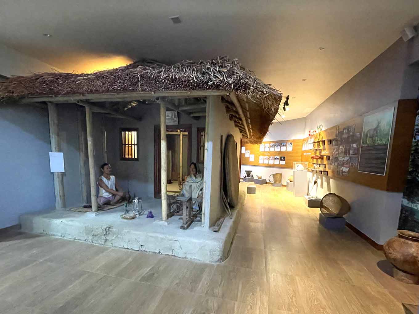 Photo of the museum’s cultural section, including a traditional house from one of the region’s ethnic communities and household items