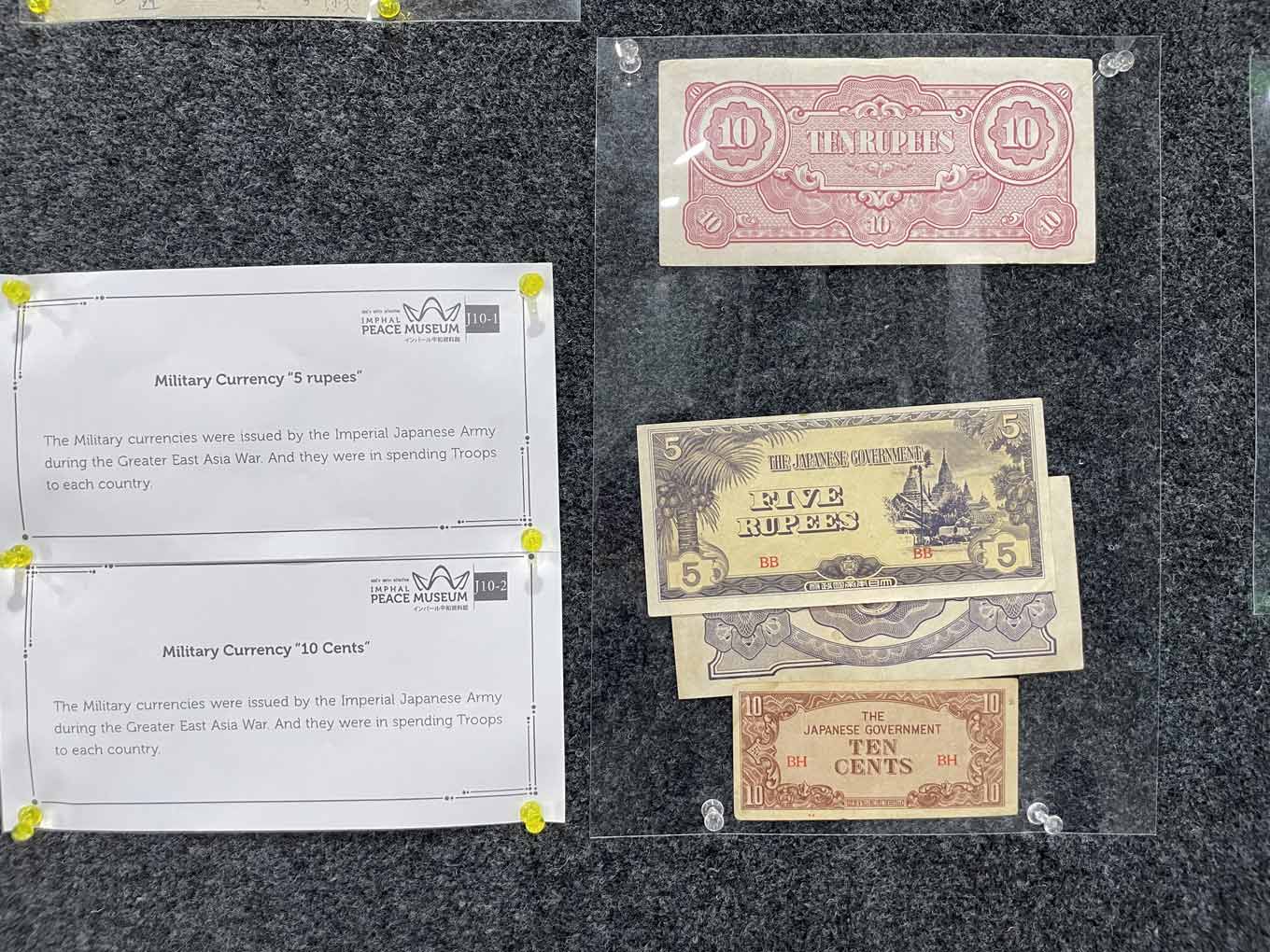 Photo of military currency notes mounted on a display panel