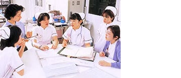 Photo of hospice nurses discussing a case