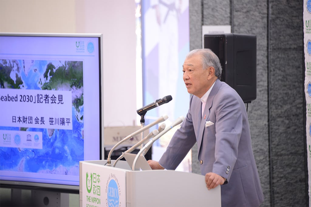 Photo of Chairman Yohei Sasakawa speaking at a press conference