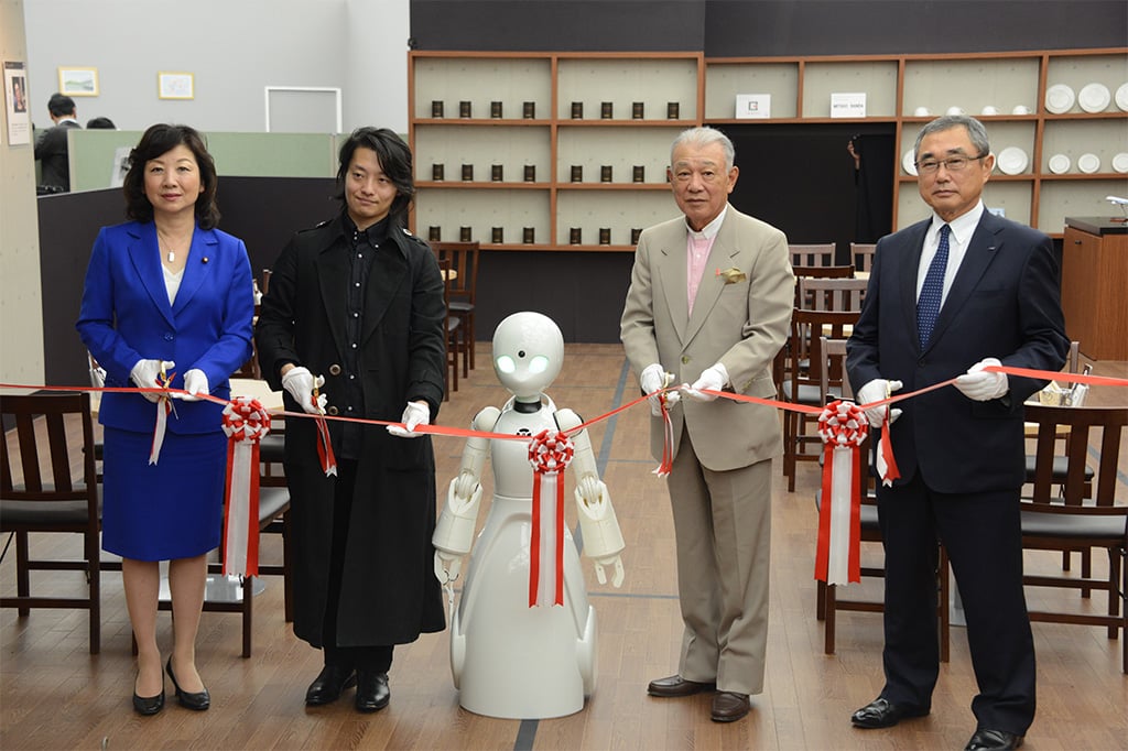 Photo of the ribbon-cutting to open the café 
